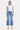 SaltTree medium wash high rise slim wide leg cropped jeans with raw hem and light distressing. Cotton blend.