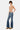 SaltTree dark wash low rise ankle flare jeans with uneven frayed hem and light distressing. Model wears size 5/26.