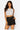 Love Poem dream state scuba belted shorts in black on a model