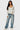 Love Poem contour scoop neck long sleeve bodysuit in white on a model