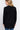 SaltTree Active Basic black long sleeve open cardigan with rib banded trim, worn by a blonde model from behind.
