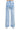 SaltTree American Bazi light blue wash wide leg jeans with back pockets, worn by a model in white sneakers.