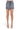 SaltTree American Bazi black wash mini denim skirt with rhinestone trim and button closure on a model