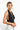 SaltTree ANWND black halter crop top with deep V-neck, shirred bust, and ribbed wide waistband worn by a blonde model