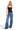 SaltTree model wearing a black ANWND double-layered ribbed knit cami top with a square neckline and thin straps.