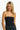 SaltTree model wearing a black ANWND strapless seamless tube top bodysuit with a smooth body-hugging fit.