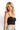 SaltTree ANWND black seamless bustier crop top worn by a blonde model with light wash denim jeans