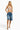 SaltTree model wearing an ANWND ivory ribbed V-neck bra top with denim shorts against a white background