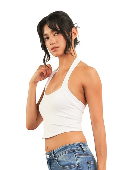 SaltTree ANWND white sleeveless halter neck cropped tank top worn by a model with blue denim jeans