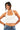 SaltTree ANWND white cropped halter neck tank top worn by a smiling model with blue jeans