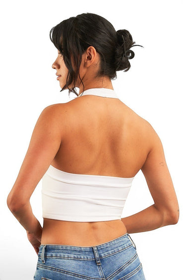 SaltTree ANWND white cropped halter neck top with hanky hem worn by a model, back view