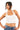 Model wearing a white SaltTree ANWND halter neck cropped tank top with a sleeveless fitted silhouette.
