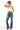 SaltTree model wearing a white ANWND cropped halter neck tank top with a hanky hem paired with blue flare jeans
