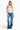 SaltTree model wearing a white ANWND sweetheart neckline bodysuit with adjustable spaghetti straps and blue jeans