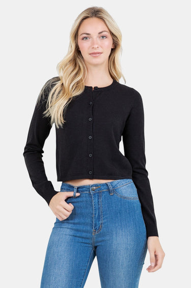 SaltTree model wearing a black slim-fit cropped button-up cardigan with long sleeves and high-waisted blue jeans.