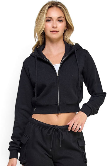 Model wearing a black SaltTree cropped zip-up hoodie in lightweight stretch terry with a drawstring hood.