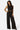 SaltTree Love Poem black crinkled plisse crop top and wide-leg pant set with all-over rhinestone embellishments