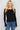 SaltTree Active Basic black round neck cardigan with button-front closure worn by a blonde model in junior sizing.