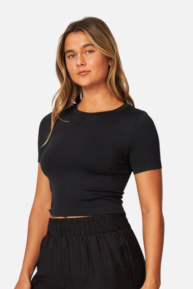 SaltTree Love Poem black seamless crew-neck crop top with cap sleeves worn by a model