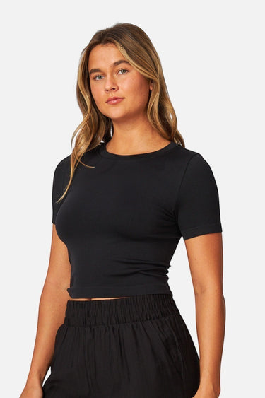 SaltTree Love Poem black seamless crew-neck crop top with cap sleeves worn by a model