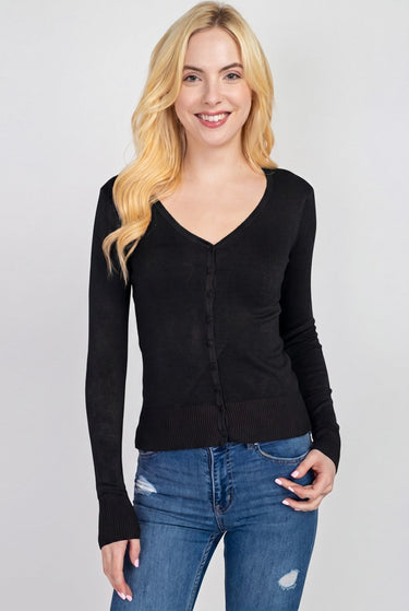 SaltTree model wearing a black Active Basic V-neck button-front cardigan in junior sizing with long sleeves.