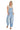 SaltTree model wearing Cello Jeans light wash cotton barrel leg denim overalls with a square neck and racerback.