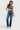 Model wearing SaltTree Cello Jeans super high rise medium wash dad jeans with a straight leg and 31 inch inseam.