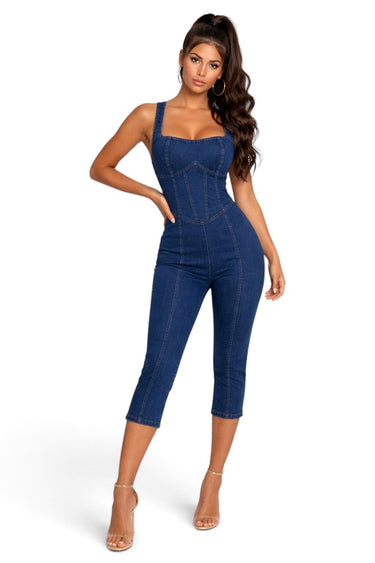 Model wearing a SaltTree DIOSA dark wash denim corset jumpsuit with a sweetheart neckline and skinny capri legs.