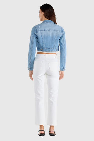 SaltTree Enjean cropped denim jacket in light wash with destructed back detail worn by a model from behind