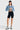 SaltTree model wearing an Enjean stone wash cropped denim jacket with chest pockets and a button-front closure.