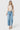 Model wearing SaltTree Flying Monkey medium wash high rise wide leg cropped jeans with a drawstring waist tie.