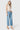 Model wearing SaltTree Flying Monkey medium wash high rise wide leg cropped jeans with a drawstring waist tie.