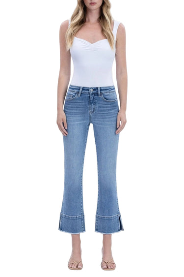 SaltTree model wearing Flying Monkey high rise medium wash kick flare jeans with a distinctive trouser slit hem.