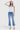 SaltTree model wearing Flying Monkey high rise medium wash denim jeans with a kick flare silhouette and slit hem