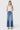 SaltTree Flying Monkey high rise wide leg jeans in medium wash with a trouser crease, worn by a model in a tank top.