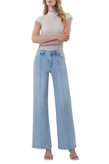 SaltTree model wearing Flying Monkey light wash high rise wide leg jeans with front cut seam detail and 31 inch inseam