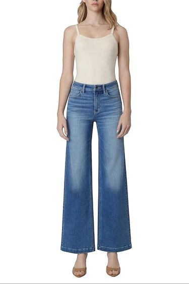 SaltTree model wearing Flying Monkey high rise wide leg trouser jeans in medium wash with a front crease