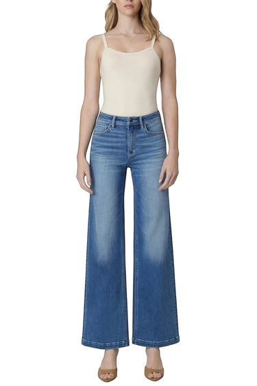 SaltTree model wearing Flying Monkey high rise wide leg trouser jeans in medium wash with a front crease
