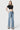 SaltTree model wearing Flying Monkey mid rise wide leg jeans in light wash with a trouser crease and hem.