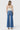 SaltTree model wearing Flying Monkey high rise medium wash wide leg trouser jeans with a 32 inch inseam from behind