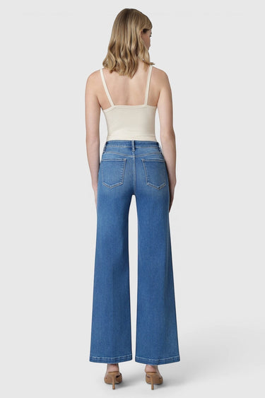 SaltTree model wearing Flying Monkey high rise medium wash wide leg trouser jeans with a 32 inch inseam from behind