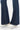SaltTree Kancan mid-rise flare petite jeans in dark wash denim with contrast stitching and frayed hem.