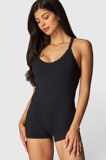 SaltTree Love Poem black airbrush onesie romper with a scoop neckline and sculpting second-skin fit on a model.