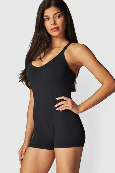 SaltTree Love Poem black airbrush onesie romper with a scoop neck and sculpting second-skin fit on a model