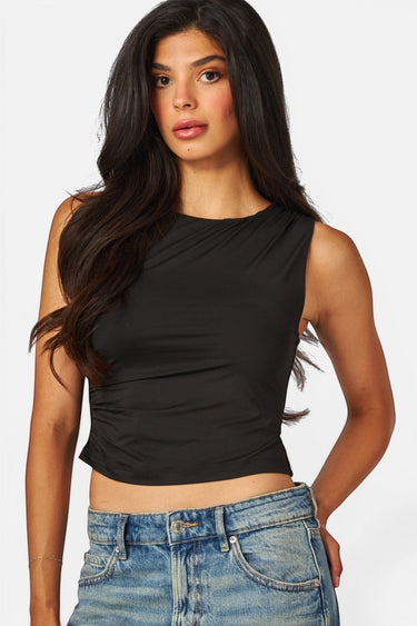 SaltTree model wearing a black Love Poem sleeveless boatneck top in smoothing double-layer jersey fabric