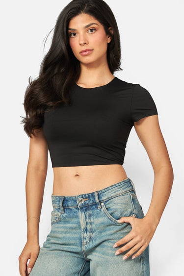 SaltTree Love Poem black double-layered cropped crew neck t-shirt worn by a model with blue jeans