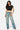 Model wearing a black SaltTree Love Poem cropped crew neck tee in smoothing double-layer fabric with blue jeans