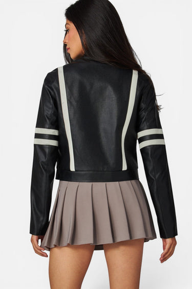 Model wearing SaltTree Love Poem black faux leather cropped moto jacket with white racing stripes, back view