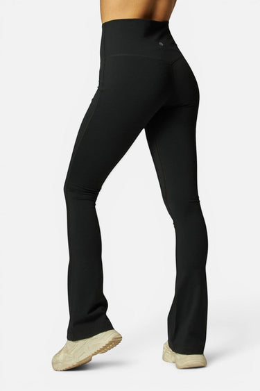 SaltTree Love Poem black high-rise kick-flare leggings with a curved shaping waistband worn by a model