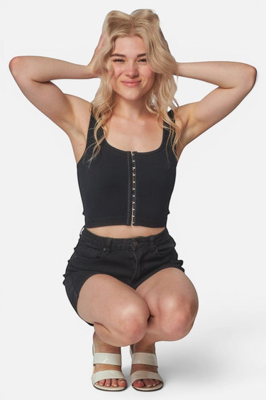 SaltTree Love Poem black ribbed seamless cropped tank top with hook-and-eye front closure worn by a blonde model.